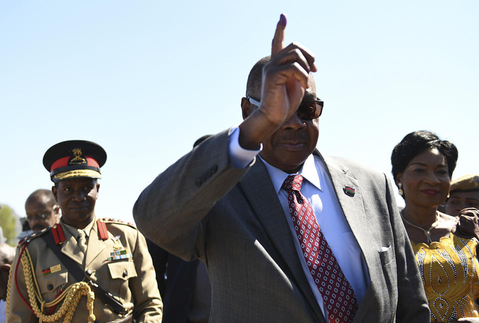 Malawi's President Peter Mutharika arrives to cast his vote at a polling station near Blantyre, Malawi, Tuesday, May 21, 2019. More than 6 million Malawians are voting Tuesday for president, parliament and local councils in the country's sixth election since the 1994 end of dictatorship. (AP Photo/Thoko Chikondi)