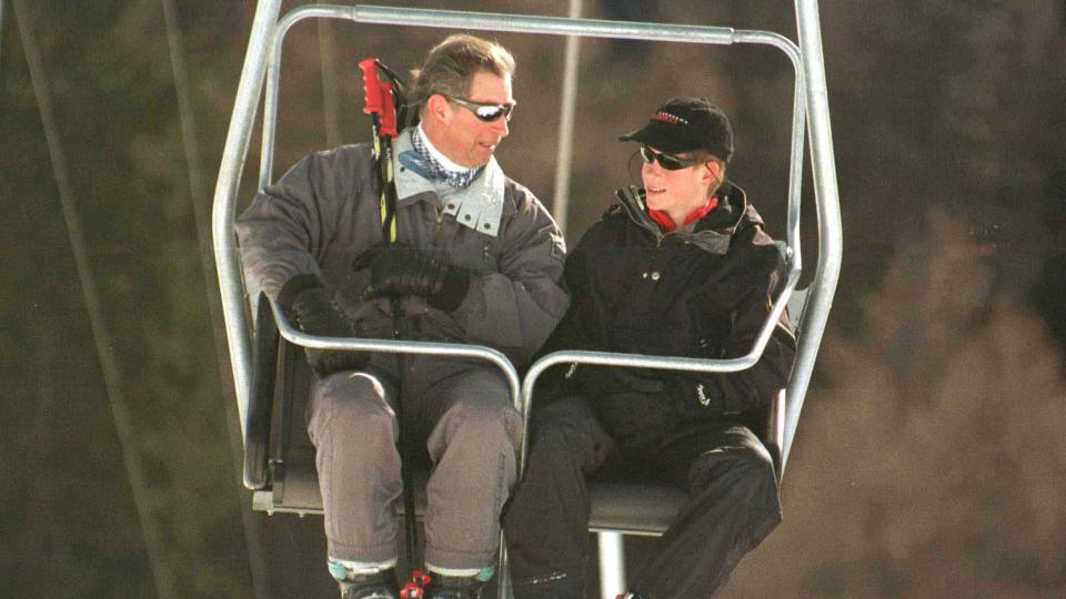 King Charles and Prince Harry take the ski lift at their skiing holiday to Klosters, Switzerland in 1999