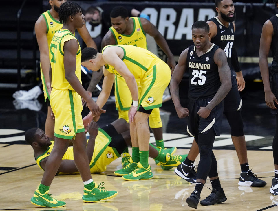 Colorado guard McKinley Wright IV, right, flexes after drawing a foul against Oregon during the second half of an NCAA college basketball game Thursday, Jan. 7, 2021, in Boulder, Colo. Colorado won 79-72. (AP Photo/David Zalubowski)