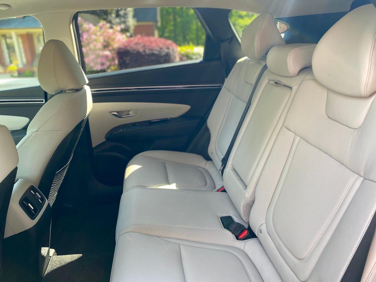 The white leather back seats of a 2024 Hyundai Tucson Hybrid SUV.