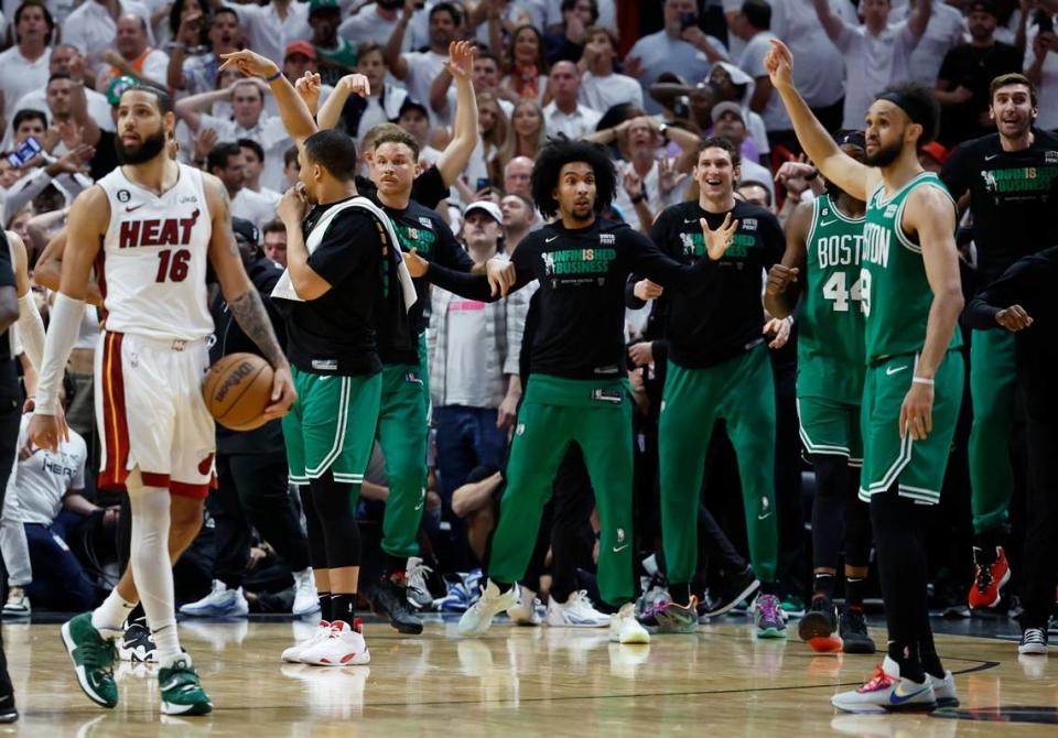 The Boston Celtics react as they wait for the call by the game officials after the final score by the Celtics during the game against the Miami Heat in Game 6 of the Eastern Conference finals at the Kaseya Center in Miami on Saturday, May 27, 2023.