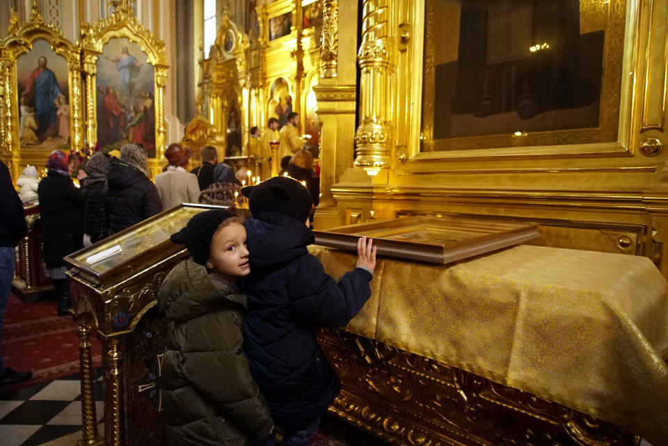 Ukrainians pray at the St. Mary Magdalene Church in Warsaw, Poland, on March 10, 2019. Ukrainians prepare to go the polls in a presidential election March 31, although millions of Ukrainians, an estimated one in 10, have already left their country to seek the opportunity of working abroad, as many see no hope if they remain at home. (AP Photo/Mstyslav Chernov)