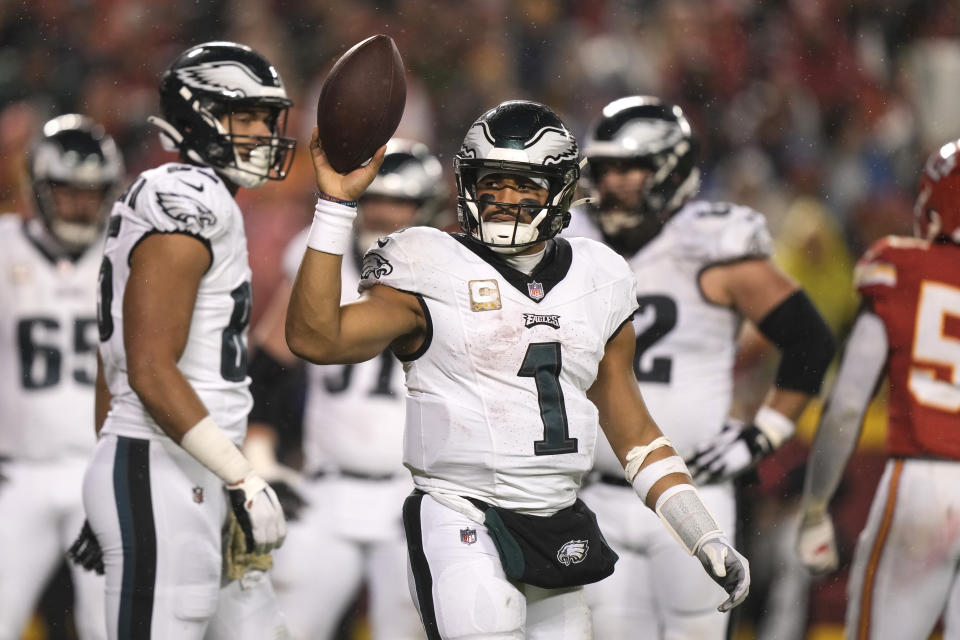Philadelphia Eagles quarterback Jalen Hurts celebrates after scoring on a 1-yard run during the second half of an NFL football game against the Kansas City Chiefs, Monday, Nov. 20, 2023, in Kansas City, Mo. (AP Photo/Charlie Riedel)