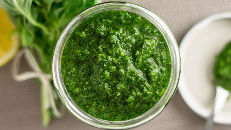 pesto in jar with basil 