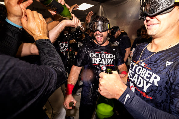 CLEVELAND, OHIO – SEPTEMBER 19: Austin Hedges #27 of the Cleveland Guardians celebrates in the clubhouse after the Guardians beat the Minnesota Twins 3-2 to clinch a playoff spot at Progressive Field on September 19, 2024 in Cleveland, Ohio. (Photo by Lauren Leigh Bacho/Getty Images)