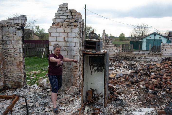 FENEVYCHI, UKRAINE - MAY 02: Inna, 37, gestures as she shows her burnt house, on May 2, 2022 in Fenevychi, Ukraine. The communities north of Kyiv were square in the path of Russia&#39;s devastating but ultimately unsuccessful attempt to seize the Ukrainian capital with forces deployed from Belarus, a Russian ally. (Photo by Alexey Furman/Getty Images) ORG XMIT: 775807509 ORIG FILE ID: 1240405845