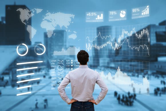 a man looking at a financial dashboard