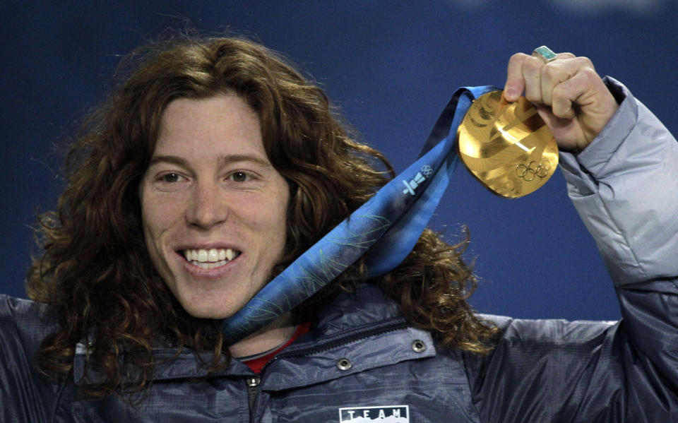 FILE - United States' gold medalist Shaun White reacts during the men's halfpipe medal ceremony at the Vancouver 2010 Olympics in Vancouver, British Columbia, Thursday, Feb. 18, 2010. The Beijing Olympics will be the fifth Olympics for the three-time gold medalist. And the last Olympics for the 35-year-old — get this — elder-statesman who is now more than double the age of some of the riders he goes against. (AP Photo/Jae C. Hong, File)