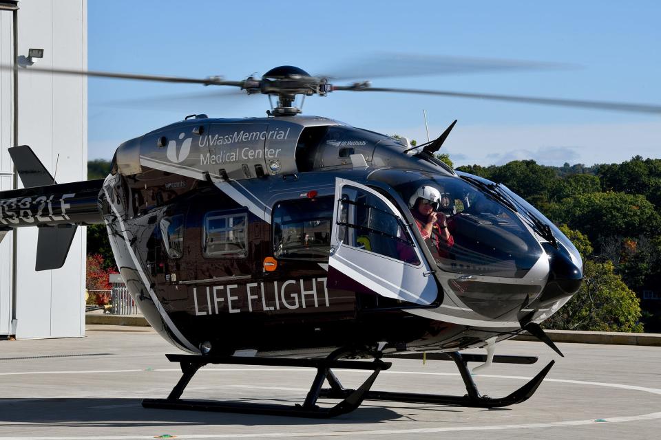 A LifeFlight helicopter and its crew prepare to lift off in response to a call.