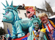 <p>A Carnival float depicting US president Donald Trump and the Statue of Liberty is shown during a traditional carnival parade in Duesseldorf, Germany, Monday, Feb. 27, 2017. REUTERS/Wolfgang Rattay </p>