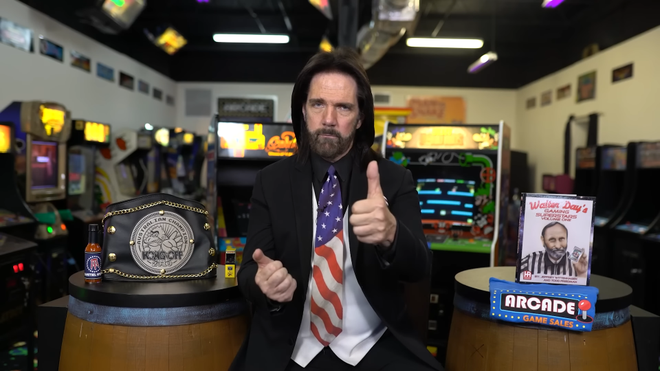  Billy Mitchell gives a thumbs-up to camera. 