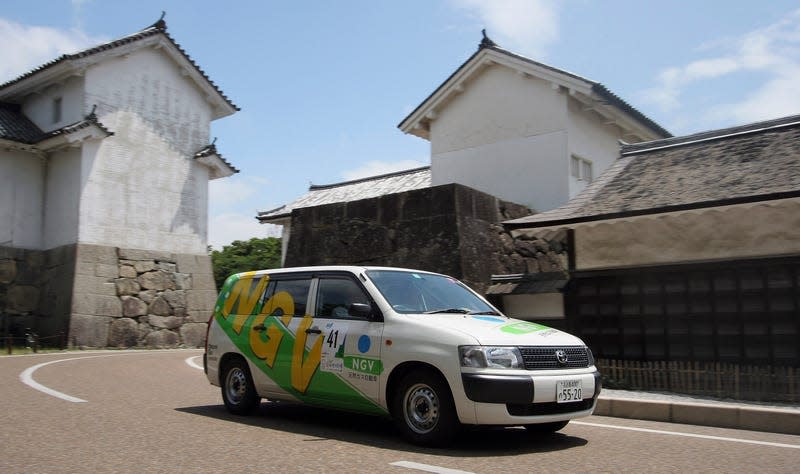 An image of a natural gas powered Toyota Probox in what looks like rural Japan