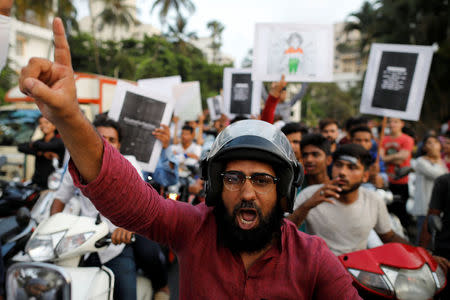 A man shouts slogan as he participates in a protest against the rape of an eight-year-old girl in Kathua near Jammu, and a teenager in Unnao, Uttar Pradesh state, in Mumbai, India, April 15, 2018. REUTERS/Danish Siddiqui