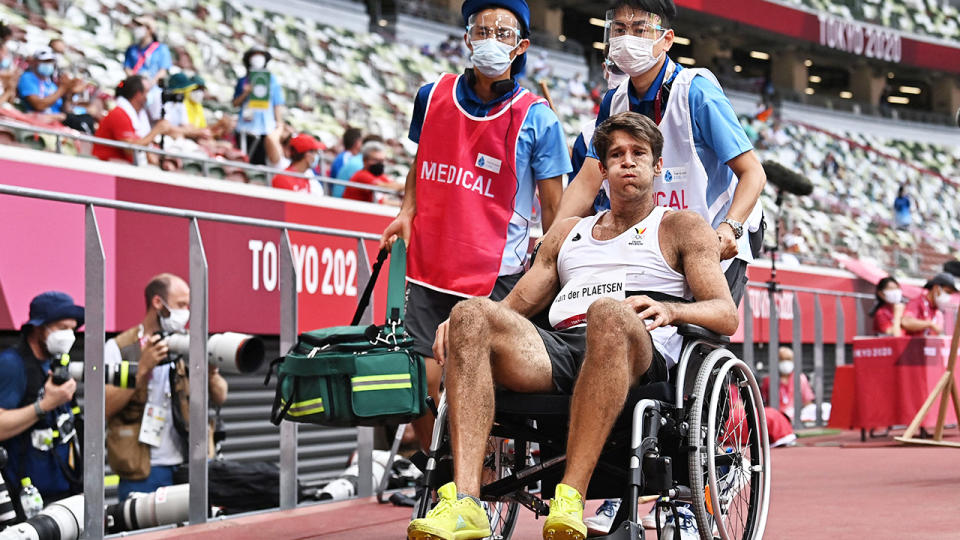 Thomas Van Der Plaetsen, pictured here being taken from the stadium in a wheelchair.