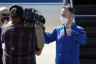 European Space Agency astronaut Matthias Maurer, of Germany, gives the thumbs up to photographers as he arrives at the Kennedy Space Center in Cape Canaveral, Fla., Tuesday, Oct. 26, 2021. The mission with a crew of four astronauts will launch aboard a Crew Dragon spacecraft on SpaceX's Falcon 9 rocket from Kennedy's Launch Complex 39A early Sunday morning to the International Space Station. (AP Photo/John Raoux)