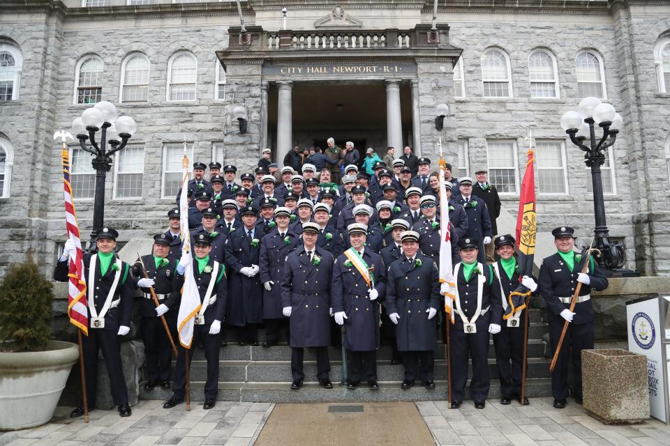 Participants in the 2023 St. Patrick's Day parade prepare to start at City Hall.