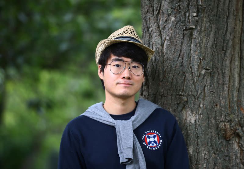 Simon Cheng, a former British Consulate employee, poses for a photograph in London