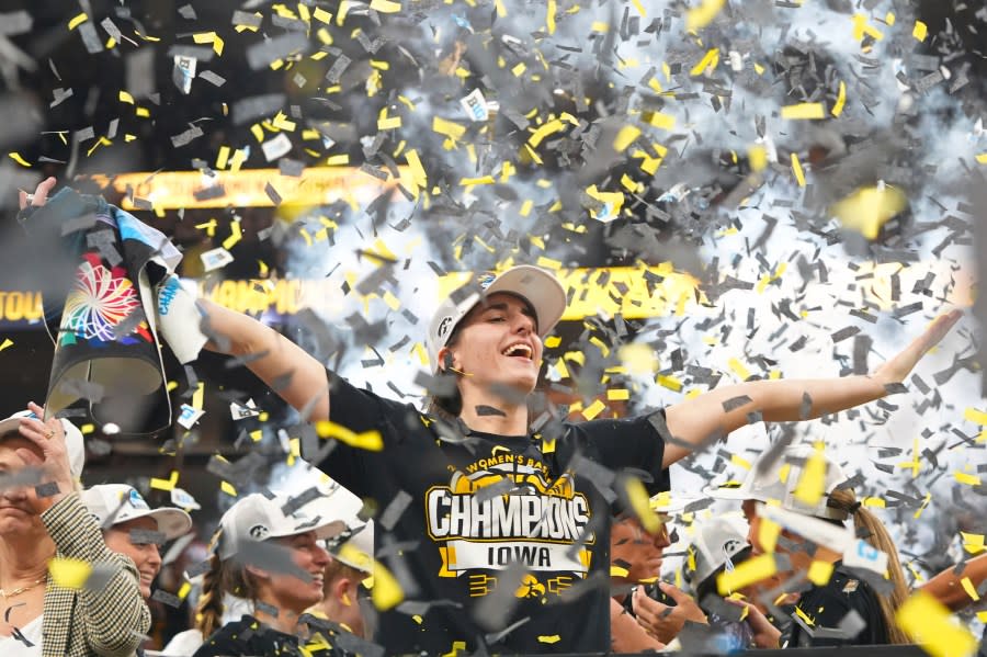 Iowa guard Caitlin Clark celebrates after the overtime win of an NCAA college basketball game against Nebraska in the final of the Big Ten women’s tournament, Sunday, March 10, 2024, in Minneapolis. (AP Photo/Abbie Parr)