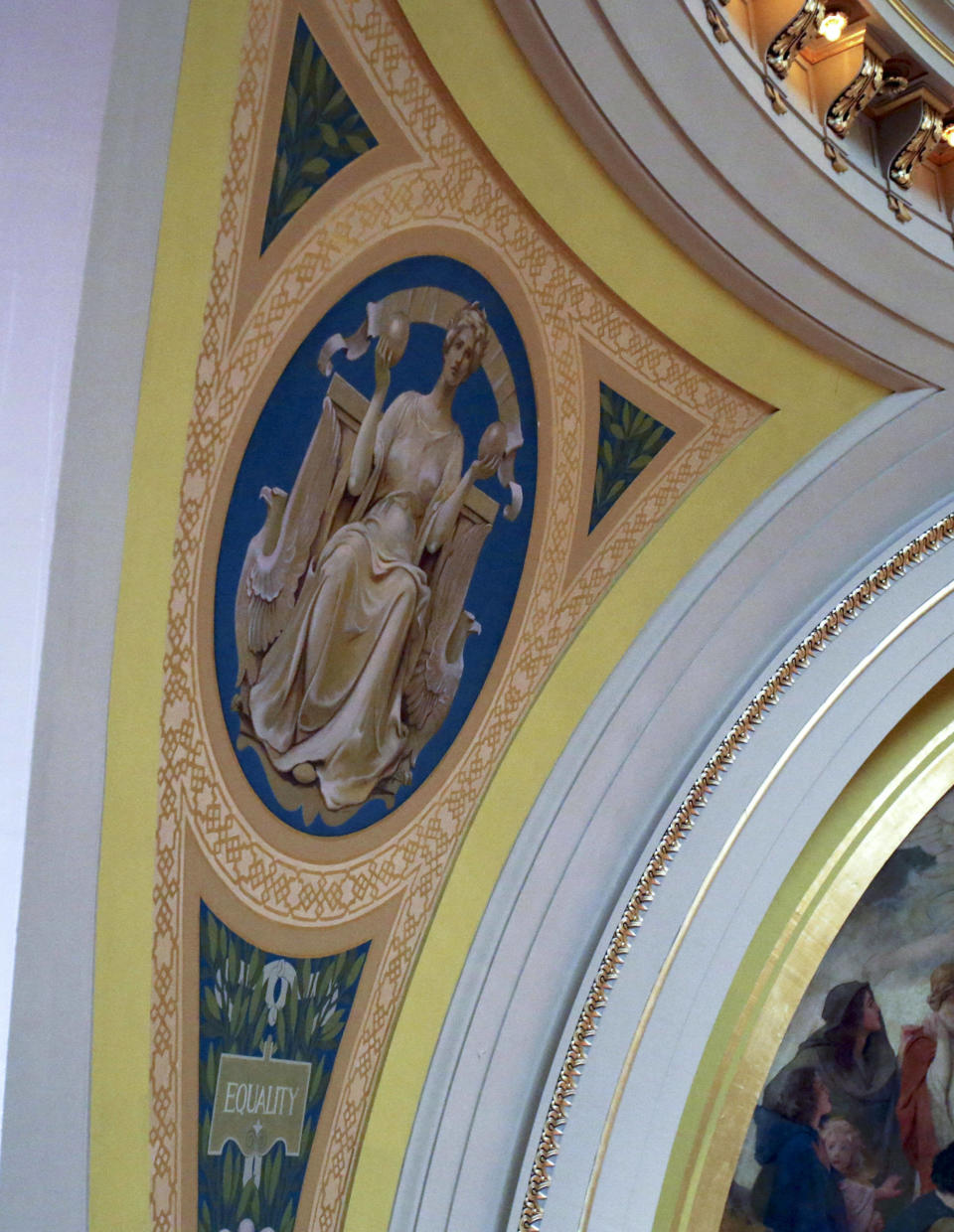 In this March 6, 2014 photo, a mural featuring an allegorical image representing equality rises over the Senate chamber at the Minnesota State Capitol in St. Paul, Minn. Beginning in the spring, work crews will take down paintings and sculpture and cover murals and statues as the renovation continues on the century old building. (AP Photo/Jim Mone)