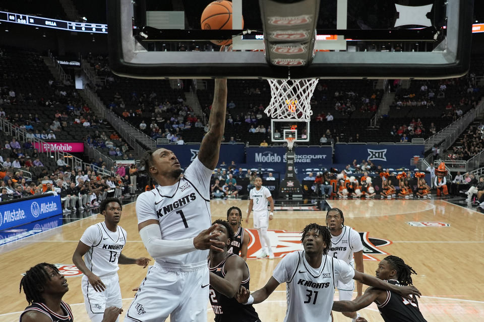 UCF guard Antwann Jones (1) shoots during the second half of an NCAA college basketball game against Oklahoma State Tuesday, March 12, 2024, in Kansas City, Mo. UCF won 77-62. (AP Photo/Charlie Riedel)