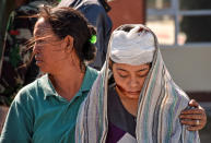 <p>A woman injured during an earthquake walks outside the North Lombok Hospital in Tanjung, North Lombok, Indonesia, Aug. 6, 2018. (Photo: Antara Foto/Ahmad Subaidi via Reuters) </p>