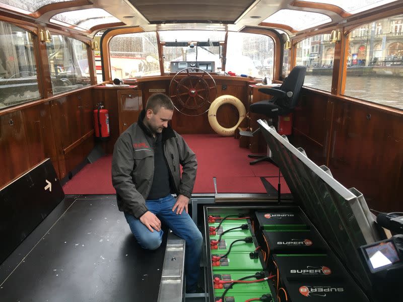 Oscar Fritschy of E-Schip shows off the batteries of the Gerarda Johanna canal boat in Amsterdam