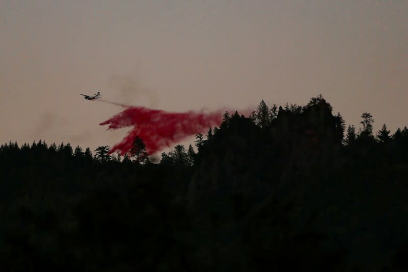 An air tanker makes a retardant drop while battling the Kincade fire near Calistoga, California
