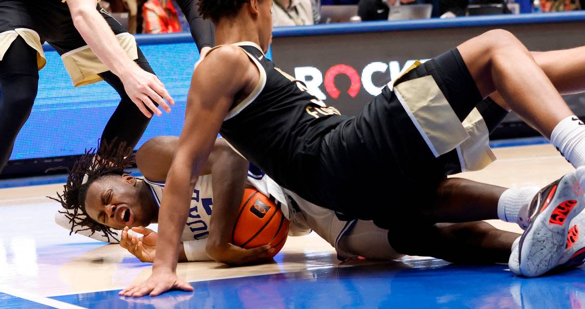 Duke’s Mark Mitchell (25) dives on a loose ball as Wake Forest’s Bobi Klintman (34) falls on him during the second half of Duke’s 75-73 victory over Wake Forest at Cameron Indoor Stadium in Durham, N.C., Tuesday, Jan. 31, 2023.
