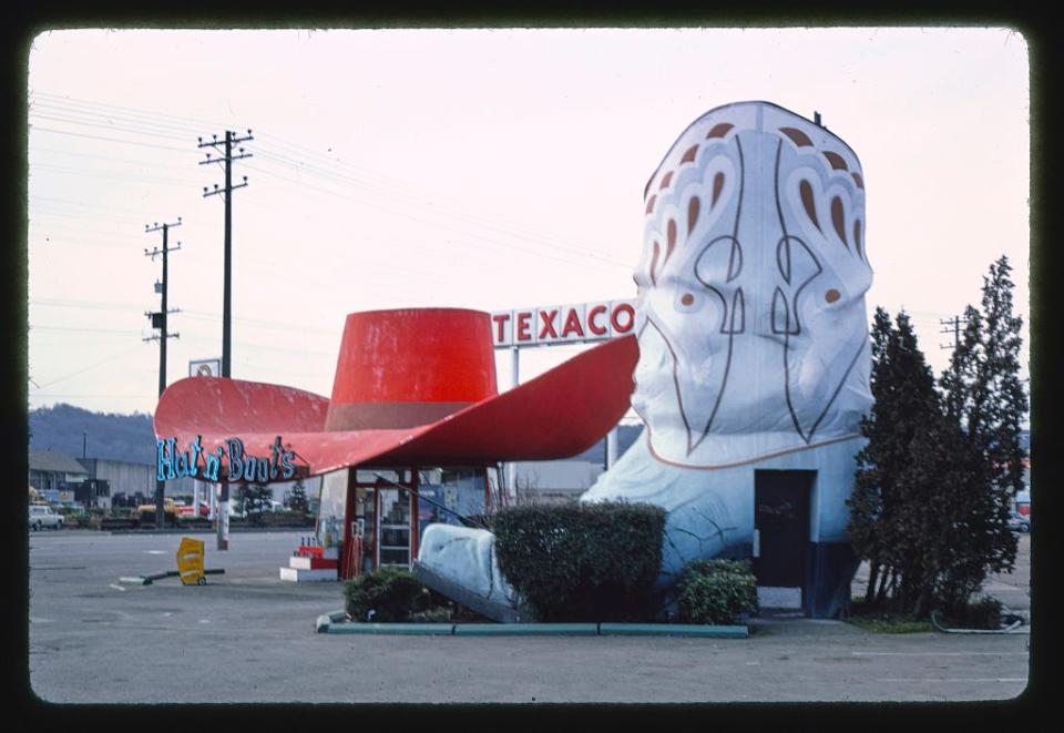 Hat n' Boots gas station (1945), boot restrooms with hat behind them view, 6800 [East] Marginal Way [South], Route 99, Seattle, Washington