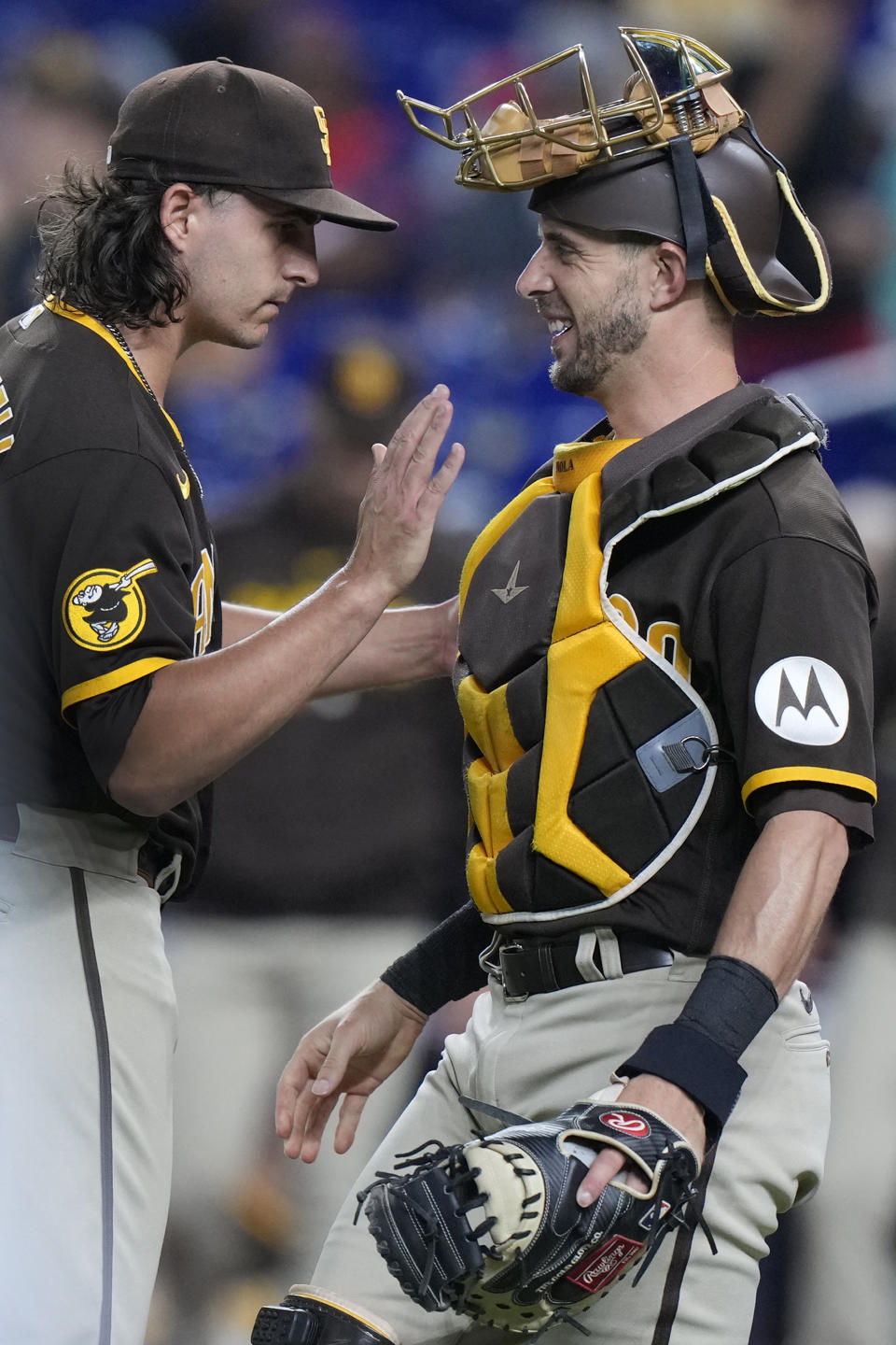 San Diego Padres relief pitcher Brent Honeywell, left, and catcher Austin Nola congratulate each other after the Padres beat the Miami Marlins 9-4 during a baseball game, Tuesday, May 30, 2023, in Miami. (AP Photo/Wilfredo Lee)