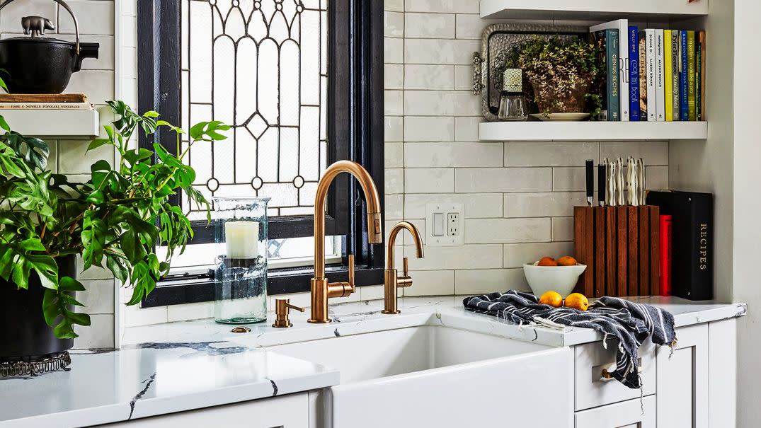 kitchen with stained glass window panel, white subway tile, farmhouse sink, open shelving a dreamy retreat modern colors