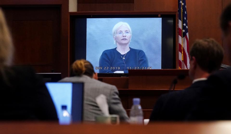 Ellen Barkin on a video screen in court