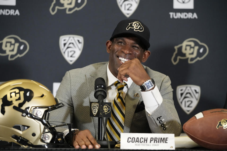 FILE - Deion Sanders speaks after being introduced as the new head football coach at the University of Colorado during a news conference Sunday, Dec. 4, 2022, in Boulder, Colo. The University of Colorado introduced a pilot program that makes the credit review for transfer students a more seamless process. It may have been the move that ultimately lured Deion “Coach Prime” Sanders to Boulder. (AP Photo/David Zalubowski, File)