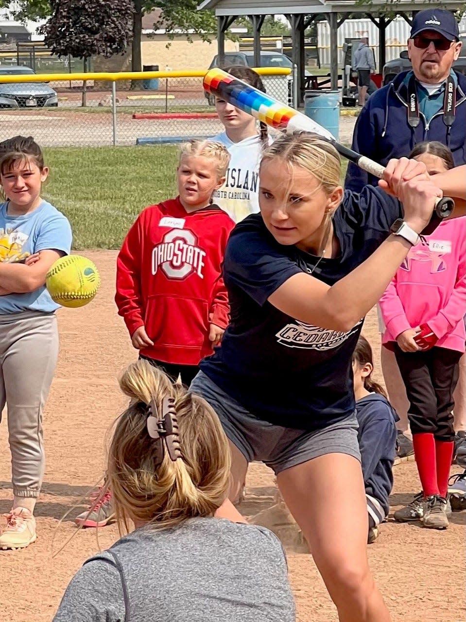 Cardington's Dana Bertke, a sophomore outfielder at Cedarville, demonstrates hitting during the Greg Swepston youth clinic last year.