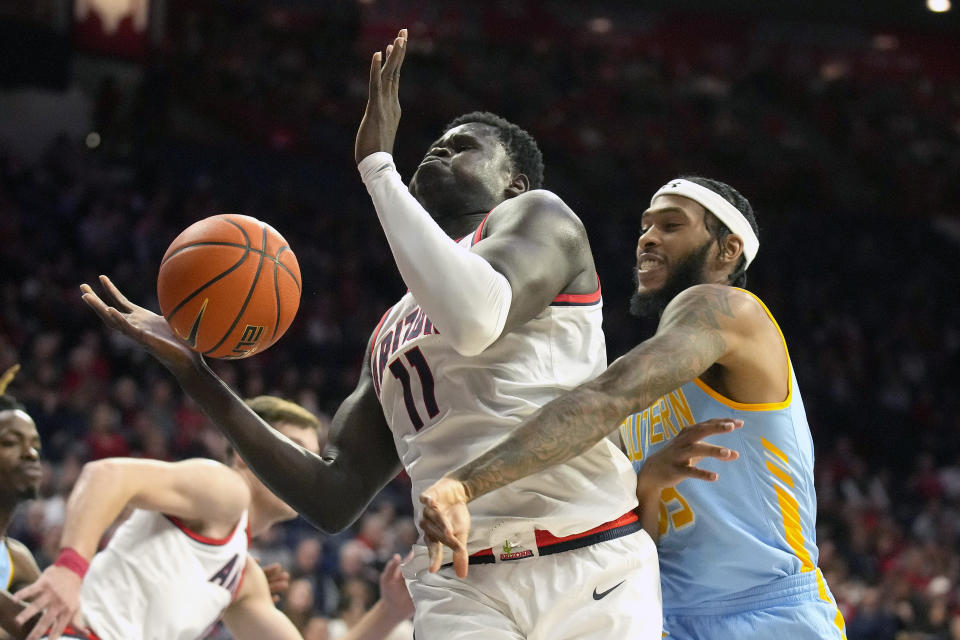 Southern University guard Tyrone Lyons, right, pressures Arizona center Oumar Ballo (11) during the first half of an NCAA college basketball game, Friday, Nov. 11, 2022, in Tucson, Ariz. (AP Photo/Rick Scuteri)