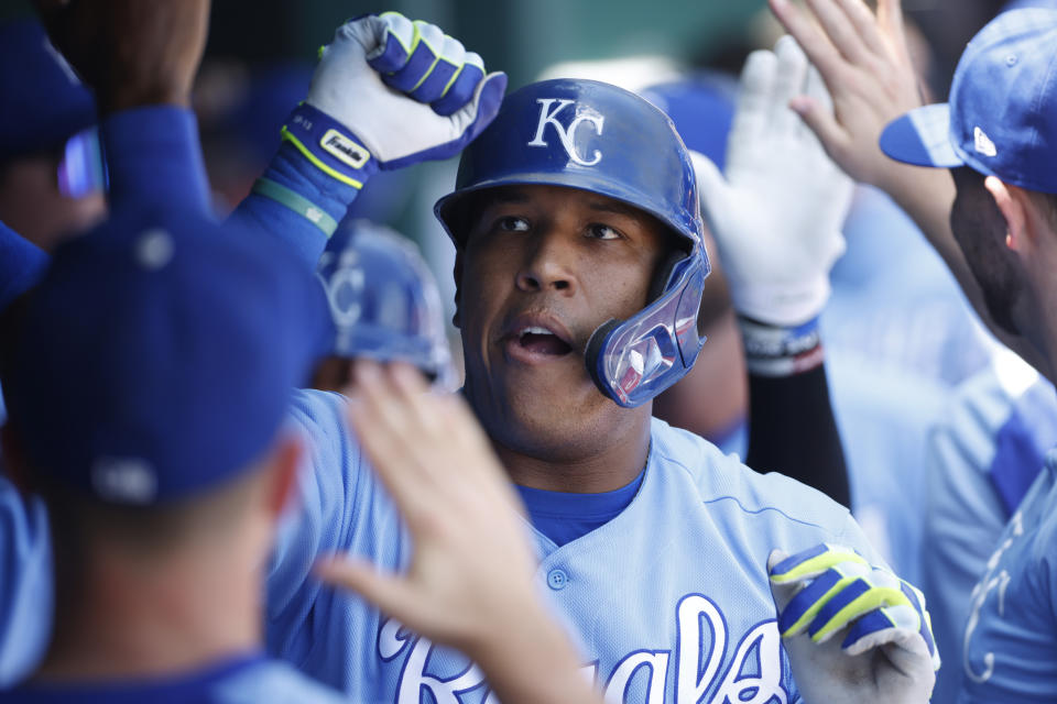 Kansas City Royals' Salvador Perez celebrates in the dugout following his two-run home run during the first inning of a baseball game at Kauffman Stadium in Kansas City, Mo., Thursday, July 29, 2021. (AP Photo/Colin E. Braley)