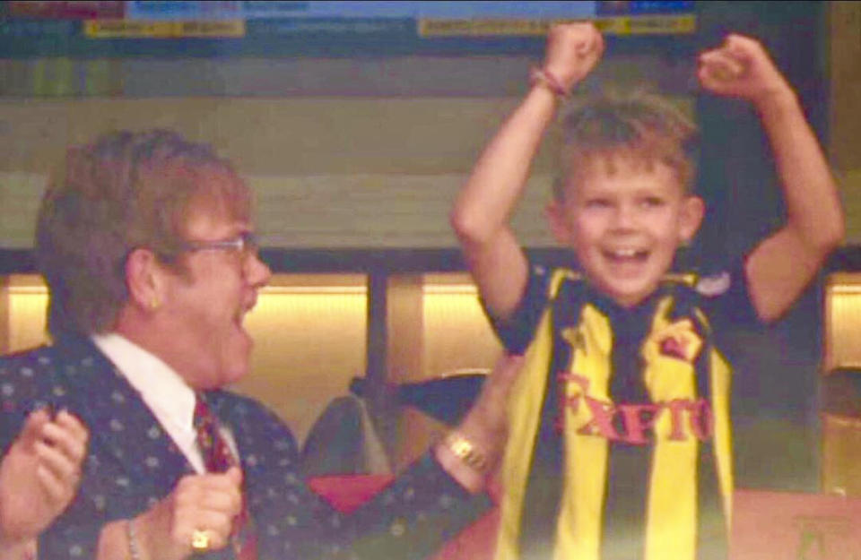 Elton John and Zachary at a Watford F.C. Game