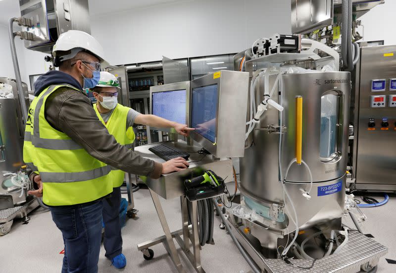 Staff set up an antibody production line at the Ibex building of Lonza in Visp