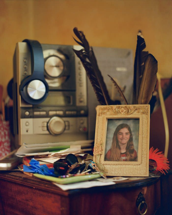 Mama Lu’s bedside table photographed in 2023 featuring a school portrait of myself at age 12.<span class="copyright">Quetzal Maucci</span>