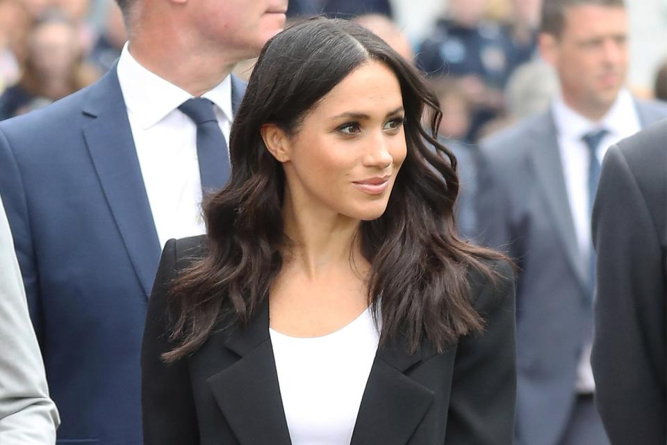 Meghan Markle changes into a sleek black suit for football club visit in Ireland