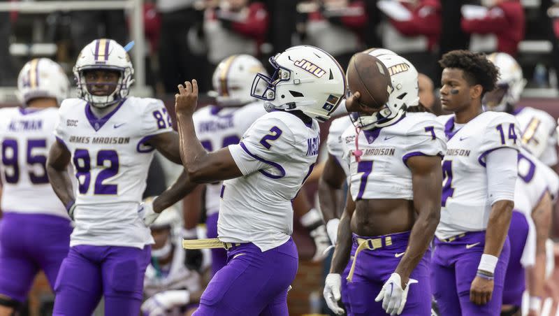 James Madison quarterback Jordan McCloud (2) warms up before the first half of an NCAA college football game against Troy on Sept. 16, 2023, in Troy, Ala.