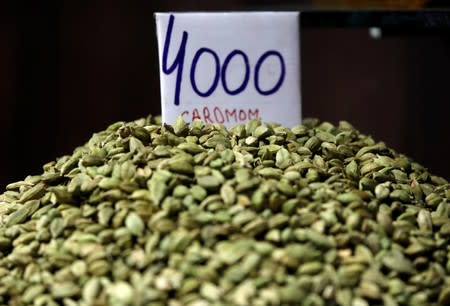 A price tag is seen on a sample of cardamom on display for sale in a market area in the old quarters of Delhi