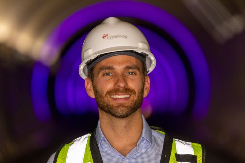 FILE PHOTO: Josh Giegel, co-founder and CEO of Virgin Hyperloop, poses inside a hyperloop tube at the company's hyperloop facility near Las Vegas