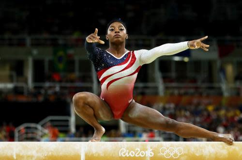 Gymnastics - Artistic - Olympics: Day 4<br>RIO DE JANEIRO, BRAZIL - AUGUST 09:  Simone Biles of the United States competes on the balance beam during the Artistic Gymnastics Women's Team Final on Day 4 of the Rio 2016 Olympic Games at the Rio Olympic Arena on August 9, 2016 in Rio de Janeiro, Brazil.  (Photo by Lars Baron/Getty Images)