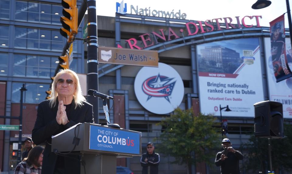 Guitarist Joe Walsh shows his gratitude after giving remarks as "Joe Walsh Way" was dedicated Wednesday afternoon. The City of Columbus and the Columbus Music Commission collaborated to honor the Eagles guitarist and Columbus homegrown hero with the ceremonial street naming. The sign was posted at Nationwide Boulevard and North Front Street.