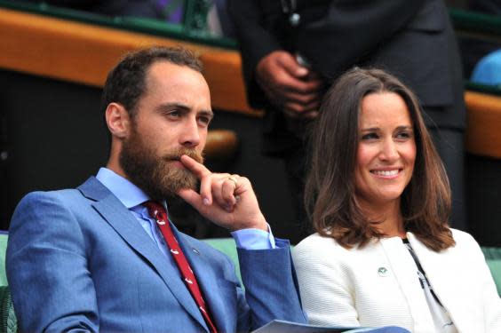 Pippa Middleton (R) and James Middleton (L), sister and brother of Catherine, Duchess of Cambridge, sit together in the Royal Box on Centre Court on day four of the 2014 Wimbledon Championships at The All England Tennis Club in Wimbledon, southwest London, on June 26, 2014. (Getty Images)