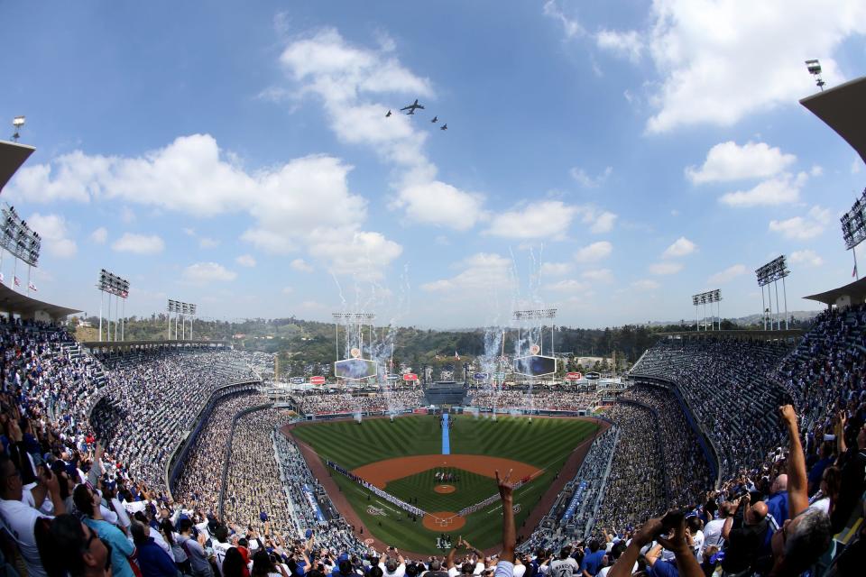 Mar 28, 2024; Los Angeles, California, USA; Players line up for the national anthem and a military flyover before the opening day game between the St. Louis Cardinals and Los Angeles Dodgers. Mandatory Credit: Jason Parkhurst-USA TODAY Sports