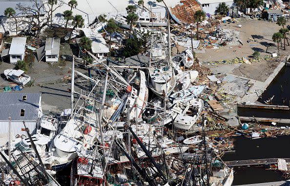 FORT MYERS BEACH,FLORIDA - SEPTEMBER 29: In an aerial view, boats are piled on top of each other after Hurricane Ian passed through the area on September 29, 2022 in Fort Myers Beach, Florida. The hurricane brought high winds, storm surge and rain to the area causing severe damage. (Photo by Joe Raedle/Getty Images)