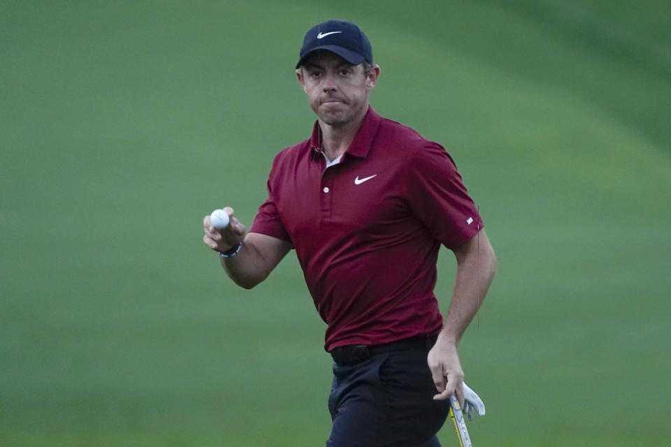 Rory McIlroy, of North Ireland, reacts after making a putt for birdie on the second hole during the first round of play in The Players Championship golf tournament Thursday, March 10, 2022, in Ponte Vedra Beach, Fla. (AP Photo/Lynne Sladky)