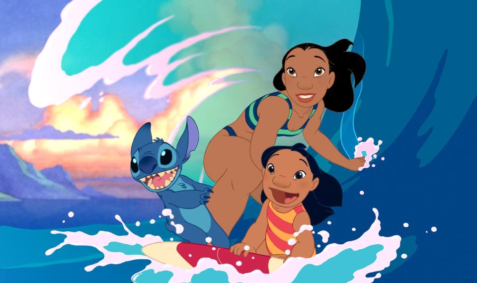 Stitch, from left, Nani and Lilo in a scene from the 2002 film "Lilo & Stitch." The casting of Sydney Agudong as Nani in the live-action remake of the film has sparked backlash from fans.